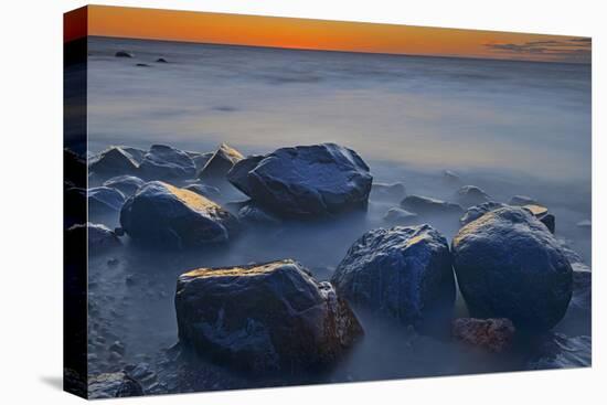 Canada, Manitoba, Winnipeg. Waves on shoreline rocks of Lake Winnipeg at dusk.-Jaynes Gallery-Premier Image Canvas