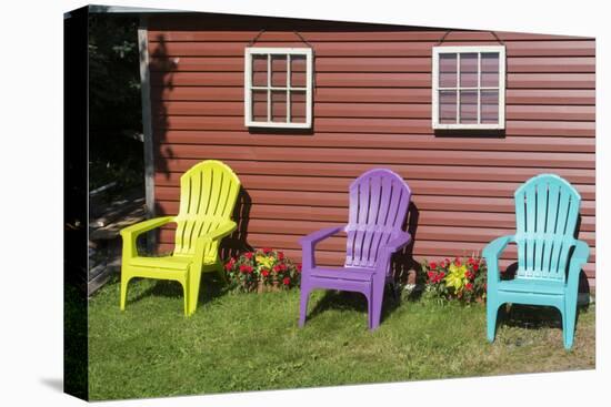 Canada, Peggy's Cove, Nova Scotia, Barn with Colorful Adirondack Chairs with Flowers-Bill Bachmann-Premier Image Canvas