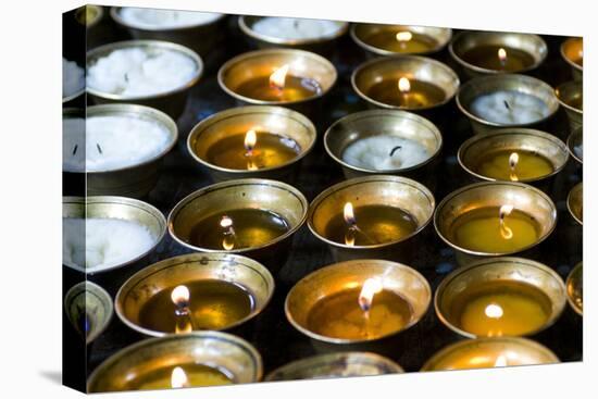 Candles Burning in the Chimi Lhakhang Monastery, Bhutan-Michael Runkel-Premier Image Canvas