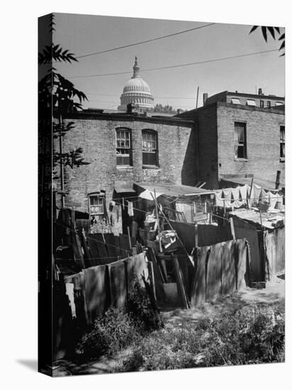 Capital Building Sitting Behind Slum Dwellings in the City-Dmitri Kessel-Premier Image Canvas