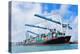 Cargo Ship at Miami Harbor with Crane and Blue Sky over Sea.-Songquan Deng-Premier Image Canvas