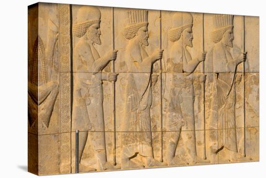 Carved relief of Royal Persian guard, Apadana Palace, Persepolis, UNESCO World Heritage Site, Iran,-James Strachan-Premier Image Canvas