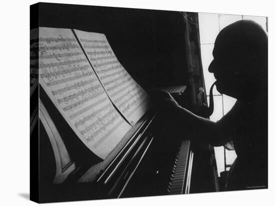 Cellist Pablo Casals at the Piano Studying a Musical Score and Smoking Pipe-Gjon Mili-Premier Image Canvas