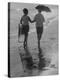 Cellist Pablo Casals Strolling on Beach with Wife Martita Near His Home in Puerto Rico-Gjon Mili-Premier Image Canvas