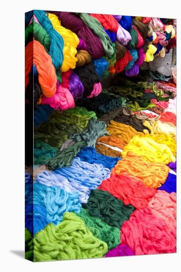 Central America, Guatemala, Chichicastenango. Colorful fabrics being sold at market day-Bill Bachmann-Premier Image Canvas