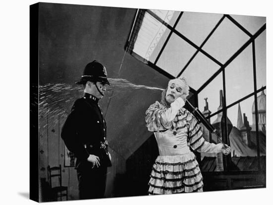 Charlie Chaplin Squirting Water Into Face of Policeman, Scene from Limelight-W^ Eugene Smith-Premier Image Canvas