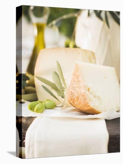 Cheese, Green Olives and Olive Oil on Table Out of Doors-null-Premier Image Canvas
