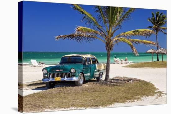 Chevrolet Classic Car under a Palm Tree on the Beach of the Island of Cayo Coco, Cuba-null-Stretched Canvas