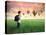 Child Carrying A Backpack Standing On A Green Meadow With Hot-Air Balloons In The Background-olly2-Stretched Canvas