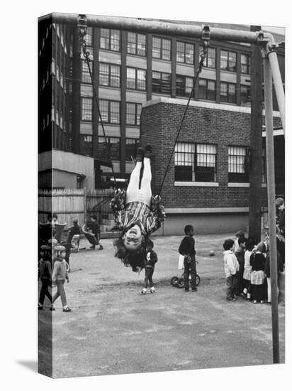 Child on Swings in Playground at the KLH Day Care Center-Leonard Mccombe-Premier Image Canvas