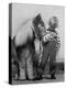 Child Standing Beside a Miniature Horse, Showing Size Comparison-Ed Clark-Premier Image Canvas