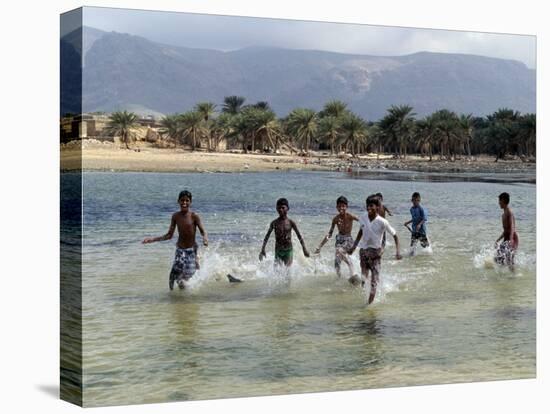 Children Enjoy a Boat Race in a Lagoon at Qalansiah, an Important Fishing Village in the Northwest-Nigel Pavitt-Premier Image Canvas