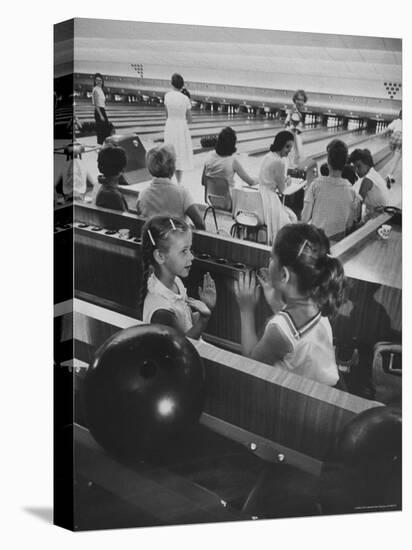 Children Entertaining Themselves While Their Mothers Compete in Bowling League-Stan Wayman-Premier Image Canvas
