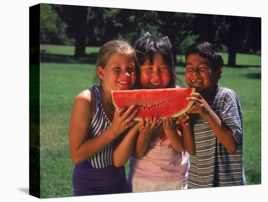 Children in Park Eating Watermelon-Mark Gibson-Premier Image Canvas