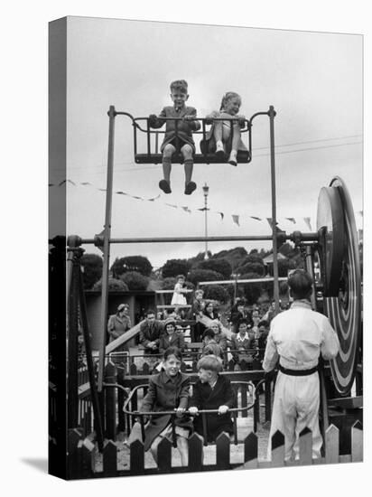 Children on Rides at an Amusement Park at a Beach Resort-null-Premier Image Canvas