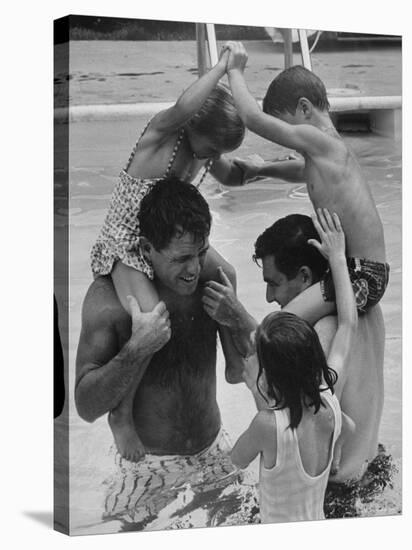 Children Playing with Their Fathers in the Swimming Pool-George Silk-Premier Image Canvas