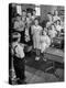 Children Reciting the Pledge of Allegiance as a Boy Holds the Us Flag in their Classroom-Bernard Hoffman-Premier Image Canvas