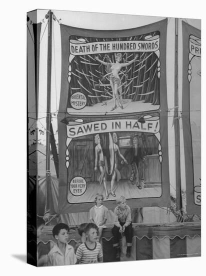 Children Sitting in Front of Banners for Magic Show Being Performed by Orson Welles-Peter Stackpole-Premier Image Canvas