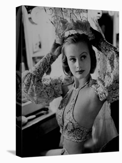 Chorus Girl Hope Chandler Securing Her Feathered Headdress as She Sits at Makeup Table-Peter Stackpole-Premier Image Canvas