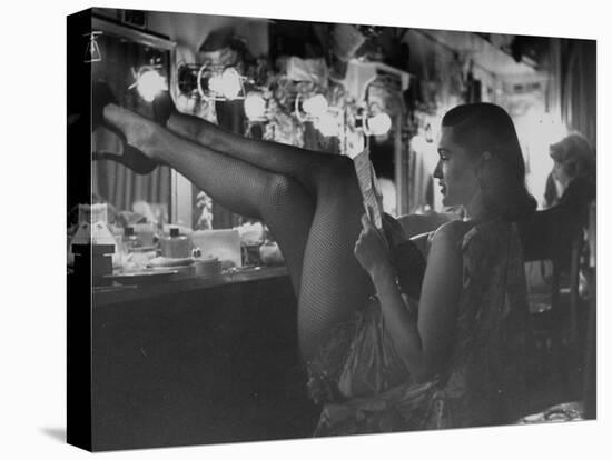 Chorus Girl-Singer Linda Lombard, Resting Her Legs after a Tough Night on Stage-George Silk-Premier Image Canvas