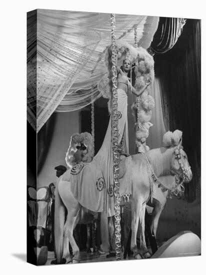 Chorus Girl Standing on Horse's Back During Filming of the Movie "The Ziegfeld Follies"-John Florea-Premier Image Canvas