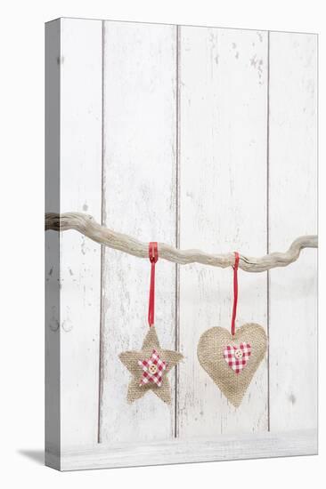 Christmas Ornaments Hanging in Front of White Wood-Andrea Haase-Premier Image Canvas