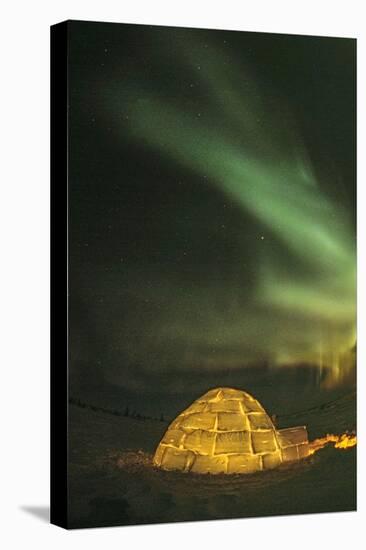 Churchill, Manitoba, Canada. Northern Lights shine above lit igloo.-Yvette Cardozo-Premier Image Canvas