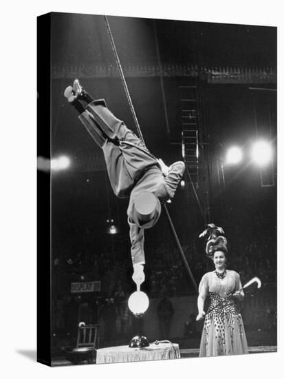 Circus Performer Balancer Unus Standing on His Index Finger on Globe Feet in Air Back of Head-Ralph Morse-Premier Image Canvas