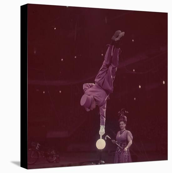 Circus Performer Balancing on Forefinger-Ralph Morse-Premier Image Canvas