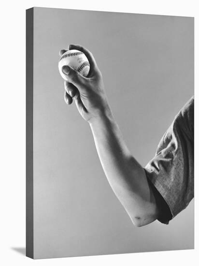 Cleveland Indians Pitcher Bob Feller Demonstrating How He Holds Ball, Beginning of Fast Ball Pitch-Gjon Mili-Premier Image Canvas