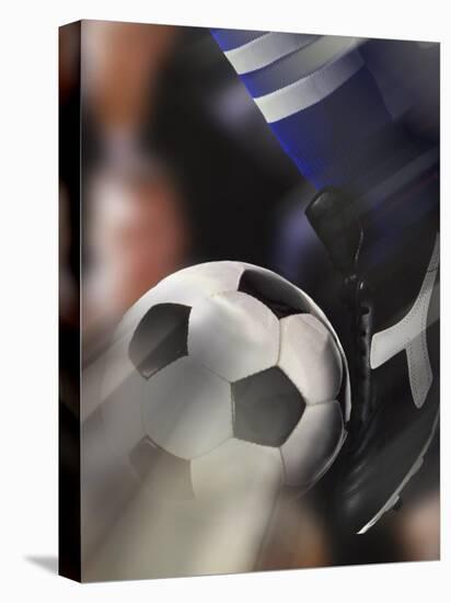 Close-up of a Soccer Player Kicking a Soccer Ball-null-Premier Image Canvas