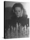 Close Up of Danielle Darrieux Looking at Chess Pieces-David Scherman-Premier Image Canvas