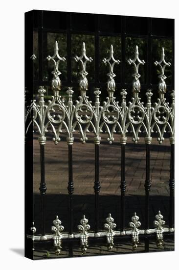 Close Up of Elaborate White Finials on Black Metal Railings-Natalie Tepper-Stretched Canvas