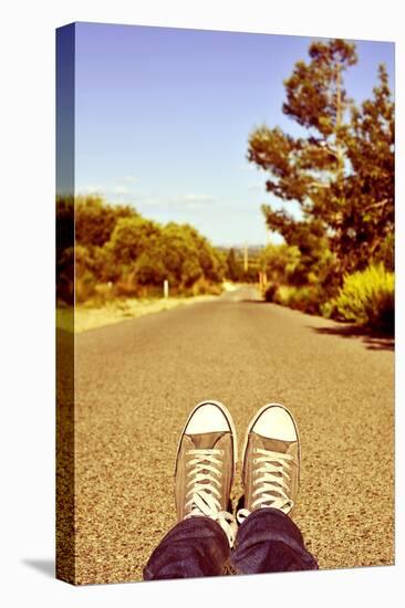 Closeup of the Feet of a Man Lying down on a Road-nito-Premier Image Canvas