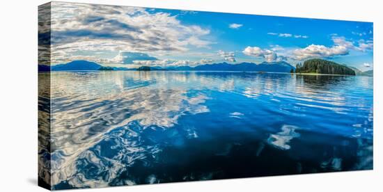 Clouds and sky reflected in the calm waters of the Inside Passage, Southeast Alaska, USA-Mark A Johnson-Premier Image Canvas