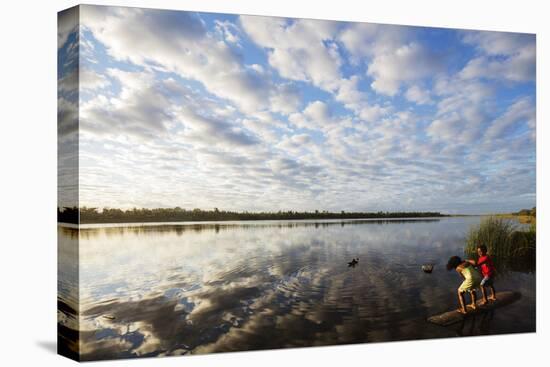Clouds at sunset, Pangalanes Lakes canal system, Tamatave, eastern area, Madagascar, Africa-Christian Kober-Premier Image Canvas