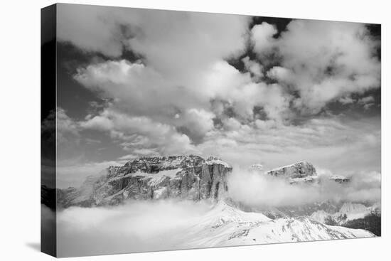 Clouds hang between the mountains of the Dolomites-Jean Schwarz-Premier Image Canvas