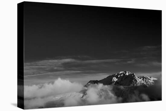 Clouds hang between the mountains of the Dolomites-Jean Schwarz-Premier Image Canvas