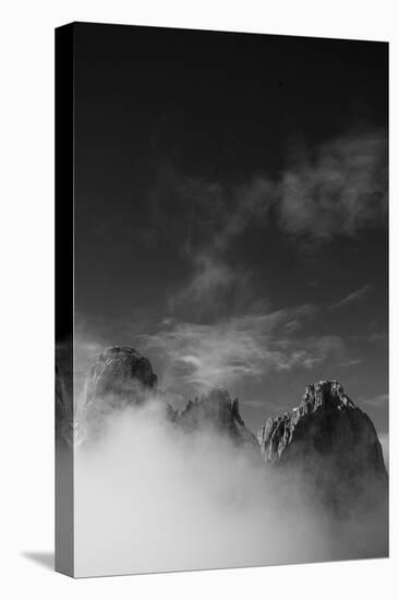 Clouds hang between the mountains of the Dolomites-Jean Schwarz-Premier Image Canvas