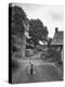 Collie Sheepdog Sitting in Road Leading Up Toward Castle Farm Owned by Beatrix Potter-George Rodger-Premier Image Canvas