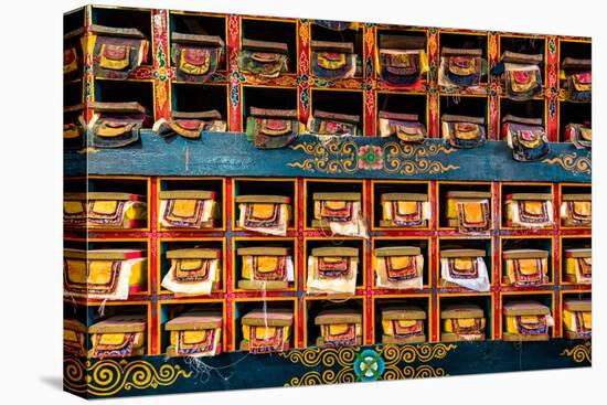 Color wall of books at buddhist monastery in Tengboche, Nepal on the way to Everest Base Camp-David Chang-Premier Image Canvas