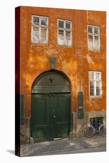 Colorful Building with Bikes Parked Outside, Copenhagen, Denmark-Inger Hogstrom-Premier Image Canvas