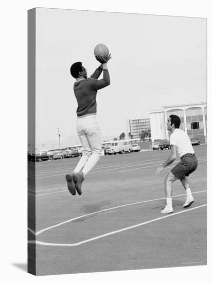 Comedian Bill Cosby Shooting Ball Against His Press Agent, Joe Sutton, During Game of Basketball-Michael Rougier-Premier Image Canvas