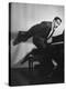 Comedian Pianist Victor Borge, in White Tie and Tails, Standing at Piano and Making Funny Faces-Peter Stackpole-Premier Image Canvas