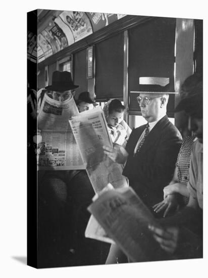 Commuters Sitting on a Train and Reading the Chicago Tribune-Charles E^ Steinheimer-Premier Image Canvas