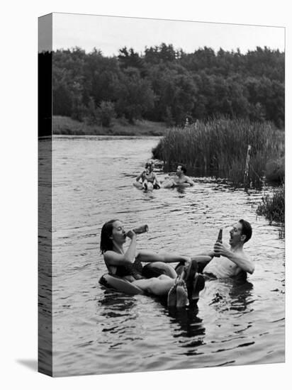 Couple Drinking Beer at Inner Tube Floating Party on the Apple River-Alfred Eisenstaedt-Premier Image Canvas