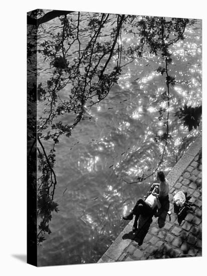 Couple Relaxing on Bank of Seine Near Notre Dame Cathedral During Lunch Hour-Alfred Eisenstaedt-Premier Image Canvas