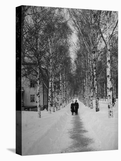 Couple Walking Through a Snow Covered Road-Carl Mydans-Premier Image Canvas