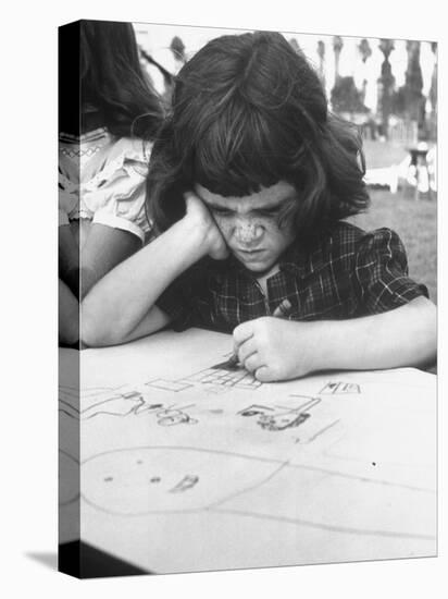Crayon Artist Working at Her Drawing-Ed Clark-Premier Image Canvas