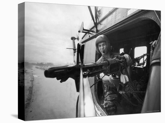 Crew Chief Lance Cpl. James C. Farley Manning Helicopter Machine Gun of Yankee Papa 13-Larry Burrows-Premier Image Canvas